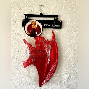 Red glittery devil costume wings from Spirit Halloween store
